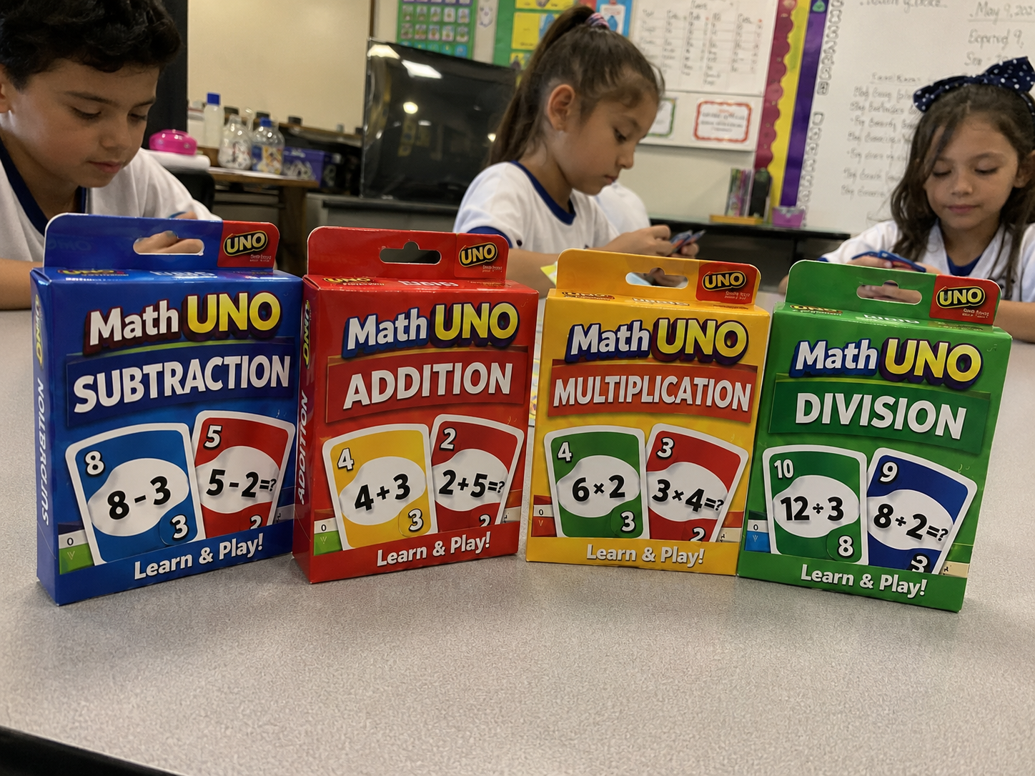 Four Math UNO decks: subtraction, addition, multiplication and division