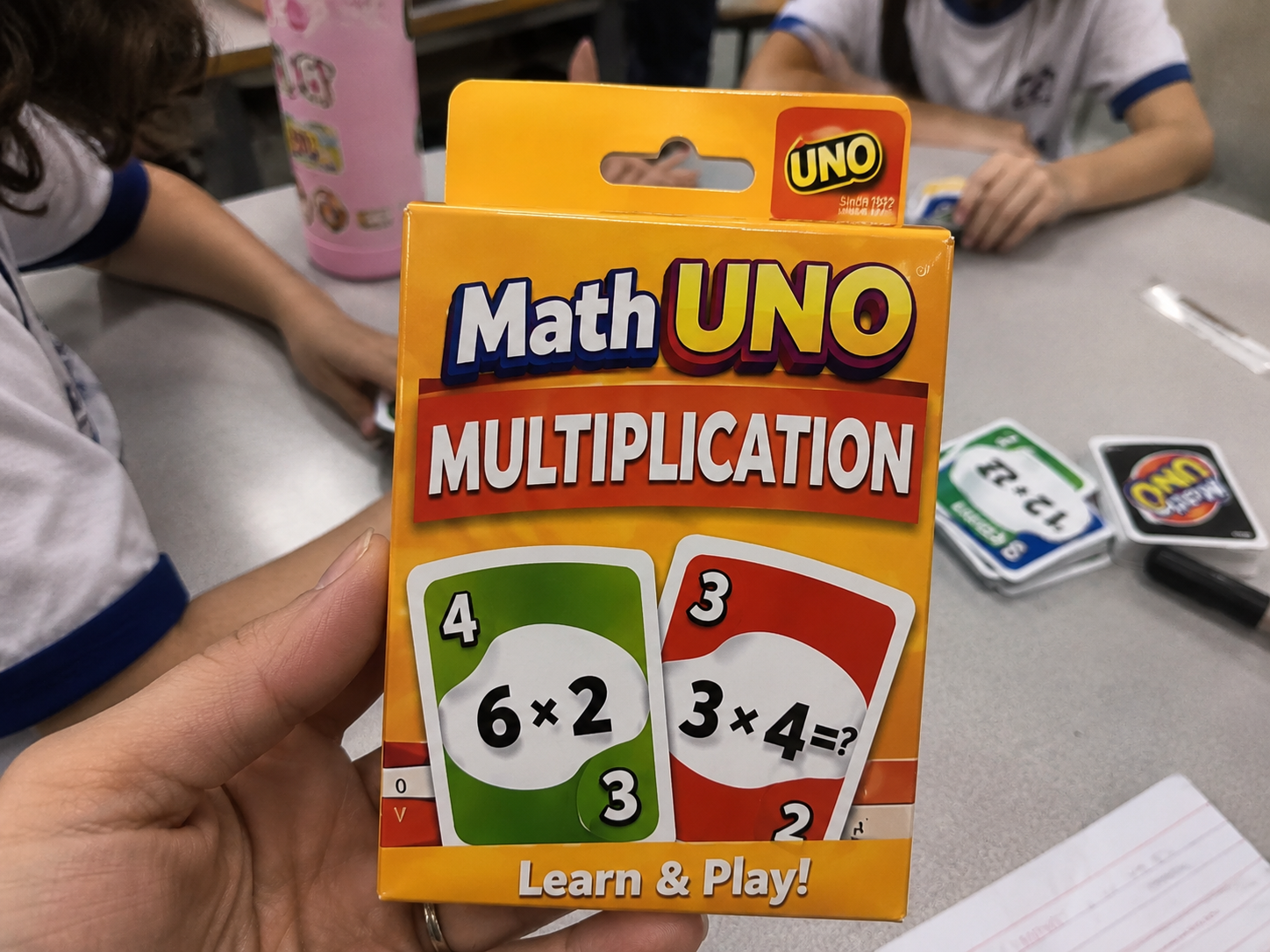 Close-up of the Math UNO Multiplication deck during a game